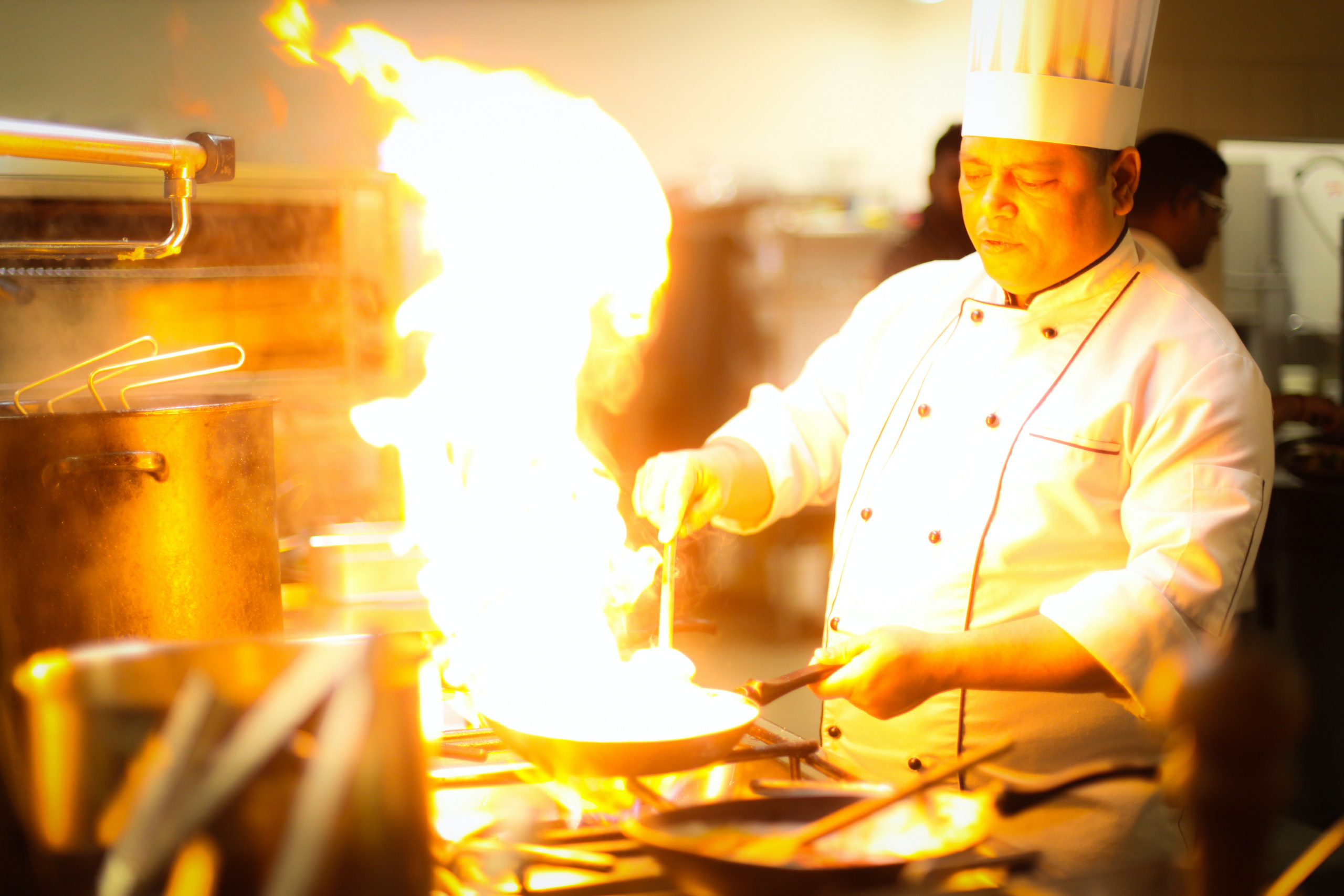 chef holding fry pan